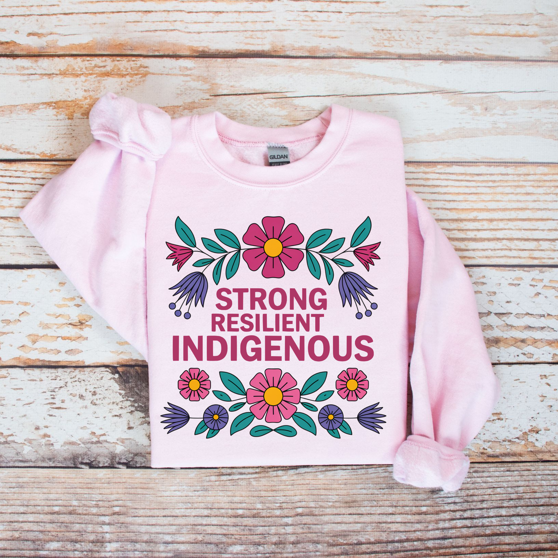 pink sweatshirt with floral design and text 'Strong Resilient Indigenous' strong resilient indigenous sweatshirt, indigenous floral crewneck, resilience sweatshirt indigenous, floral indigenous hoodie alternative, unisex indigenous sweatshirt, sahdeh spruce sweatshirts, indigenous pride pullover, native resilience fleece, indigenous artist sweatshirt, cultural strength crewneck, empowerment floral sweatshirt