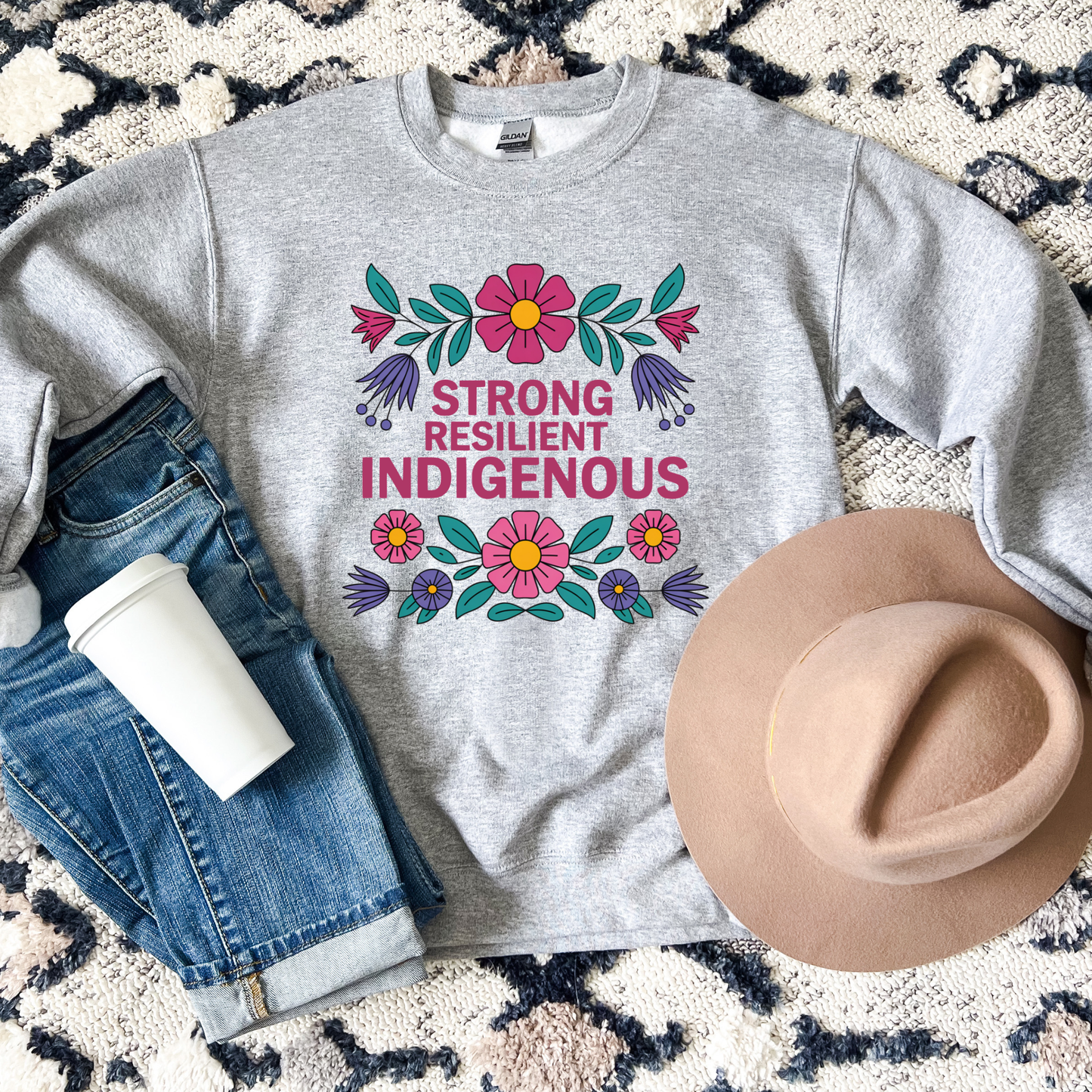 grey sweatshirt with floral design and text 'Strong Resilient Indigenous' strong resilient indigenous sweatshirt, indigenous floral crewneck, resilience sweatshirt indigenous, floral indigenous hoodie alternative, unisex indigenous sweatshirt, sahdeh spruce sweatshirts, indigenous pride pullover, native resilience fleece, indigenous artist sweatshirt, cultural strength crewneck, empowerment floral sweatshirt