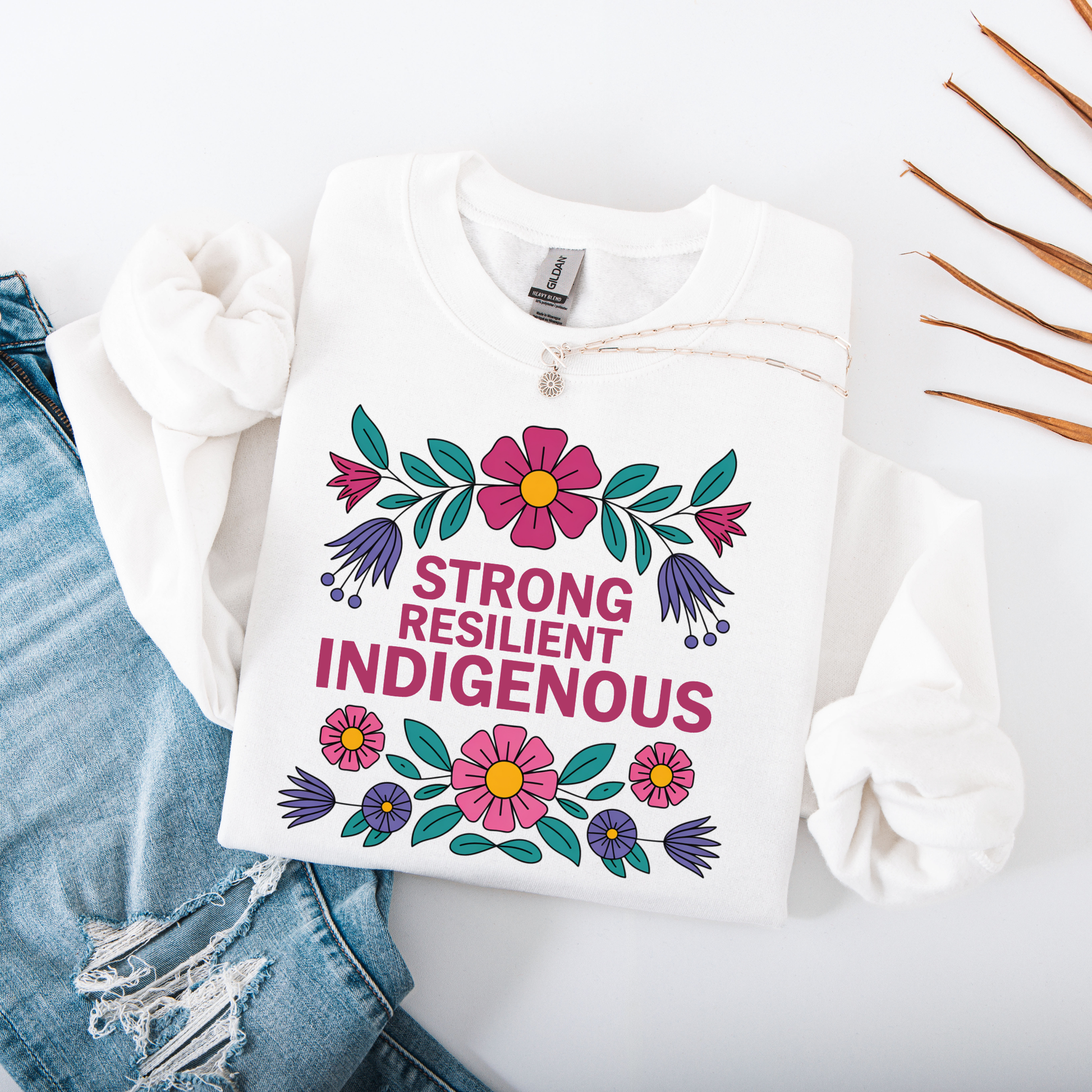White sweatshirt with floral design and text 'Strong Resilient Indigenous' strong resilient indigenous sweatshirt, indigenous floral crewneck, resilience sweatshirt indigenous, floral indigenous hoodie alternative, unisex indigenous sweatshirt, sahdeh spruce sweatshirts, indigenous pride pullover, native resilience fleece, indigenous artist sweatshirt, cultural strength crewneck, empowerment floral sweatshirt