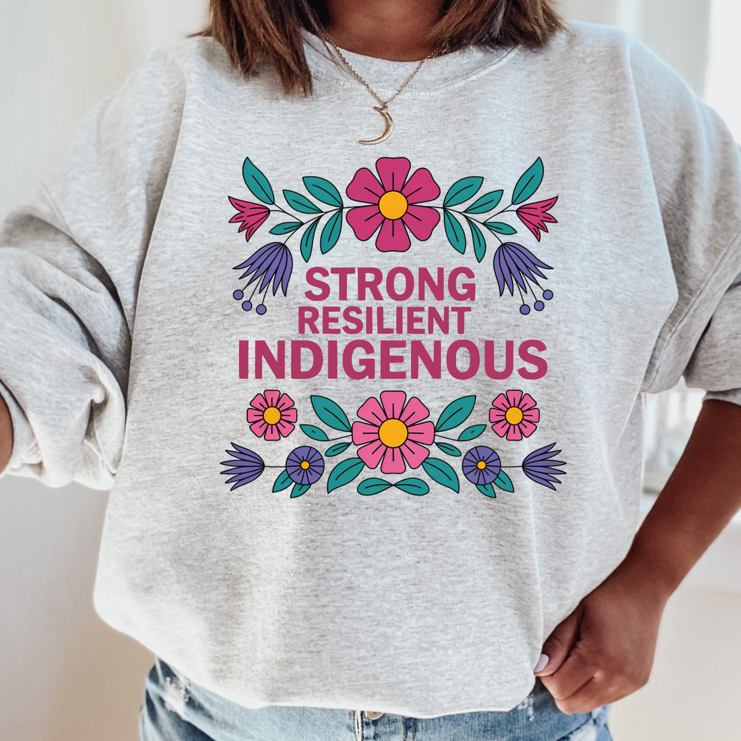 ash sweatshirt with floral design and text 'Strong Resilient Indigenous' strong resilient indigenous sweatshirt, indigenous floral crewneck, resilience sweatshirt indigenous, floral indigenous hoodie alternative, unisex indigenous sweatshirt, sahdeh spruce sweatshirts, indigenous pride pullover, native resilience fleece, indigenous artist sweatshirt, cultural strength crewneck, empowerment floral sweatshirt