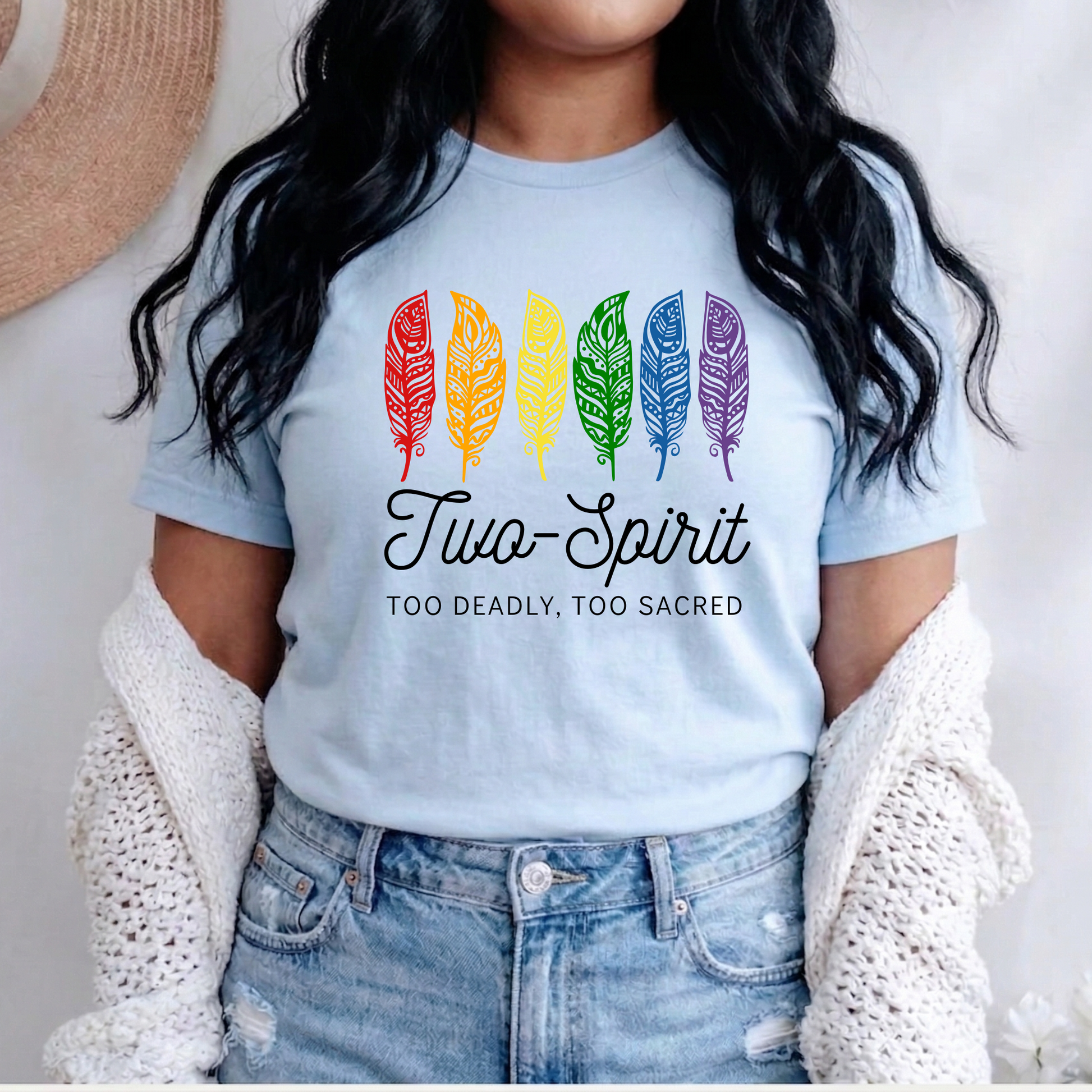 Two-Spirit Too Deadly, Too Sacred shirt with rainbow feather graphic and bold Indigenous Pride text on a unisex tee. Two-Spirit shirt, Two Spirit pride, Indigenous pride shirt, Too deadly too sacred, rainbow feather shirt, Indigenous LGBTQ tee, unisex graphic tee, Pride shirt, Two Spirit apparel, statement tee, cultural pride shirt, Indigenous owned brand, visibility shirt, sacred identity, LGBTQ Indigenous shirt