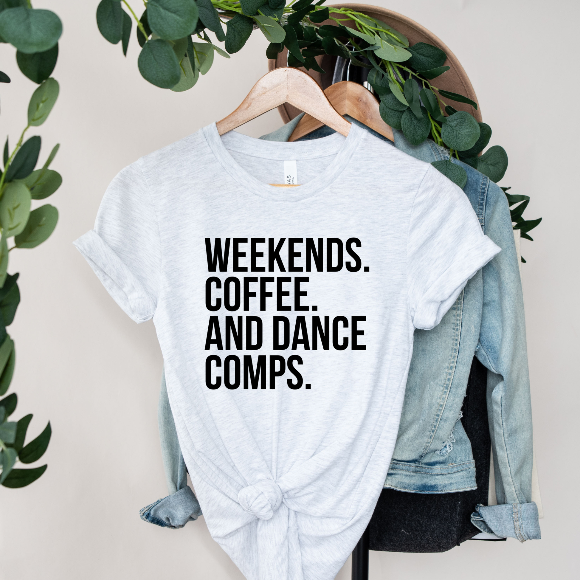 Weekends Coffee And Dance Comps unisex t-shirt featuring original playful graphic design celebrating coffee-fueled dance competition weekends on soft comfortable cotton tee, perfect for dancers and studio families.