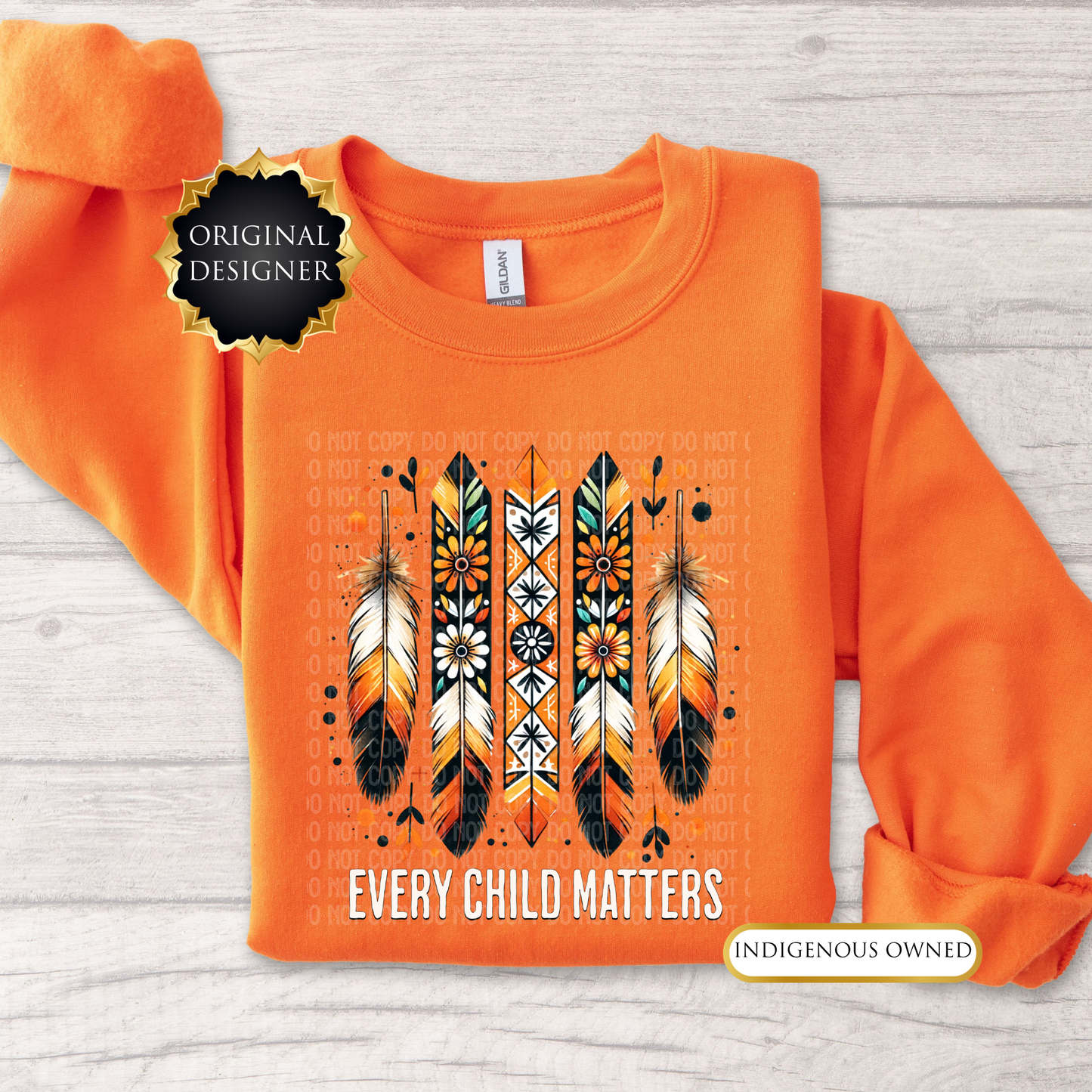 Orange sweatshirt with feather design and 'Every Child Matters' text on a wooden surface. every child matters sweatshirt, adult crewneck sweatshirt, orange shirt day sweater, feathers sweatshirt, indigenous awareness sweater, truth and reconciliation sweater, every child matters crewneck, orange crewneck, meaningful sweatshirt, indigenous designed apparel, adult graphic sweatshirt, orange shirt society licensed, awareness sweater, remembrance shirt, indigenous owned business