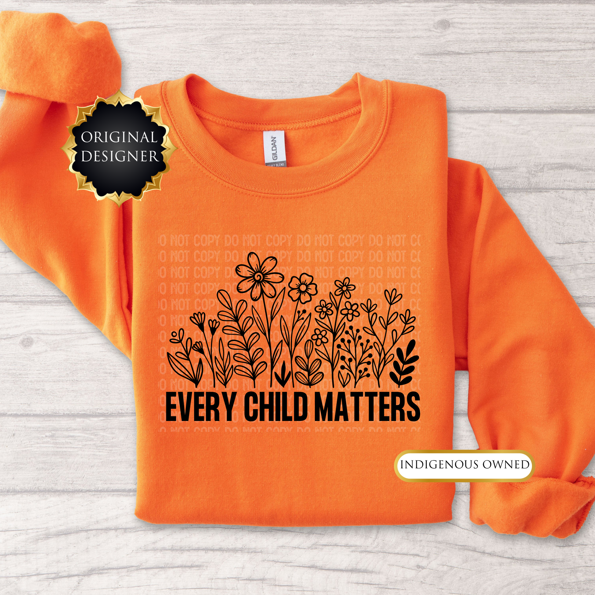 Orange sweatshirt with floral design and 'Every Child Matters' text on a light wooden surface. every child matters sweatshirt, adult crewneck sweatshirt, orange shirt day sweater, wildflowers sweatshirt, indigenous awareness sweater, truth and reconciliation sweater, every child matters crewneck, orange crewneck, meaningful sweatshirt, indigenous designed apparel, adult graphic sweatshirt, orange shirt society licensed, awareness sweater, remembrance shirt, indigenous owned business