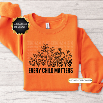 Orange sweatshirt with floral design and 'Every Child Matters' text on a light wooden surface. every child matters sweatshirt, adult crewneck sweatshirt, orange shirt day sweater, wildflowers sweatshirt, indigenous awareness sweater, truth and reconciliation sweater, every child matters crewneck, orange crewneck, meaningful sweatshirt, indigenous designed apparel, adult graphic sweatshirt, orange shirt society licensed, awareness sweater, remembrance shirt, indigenous owned business