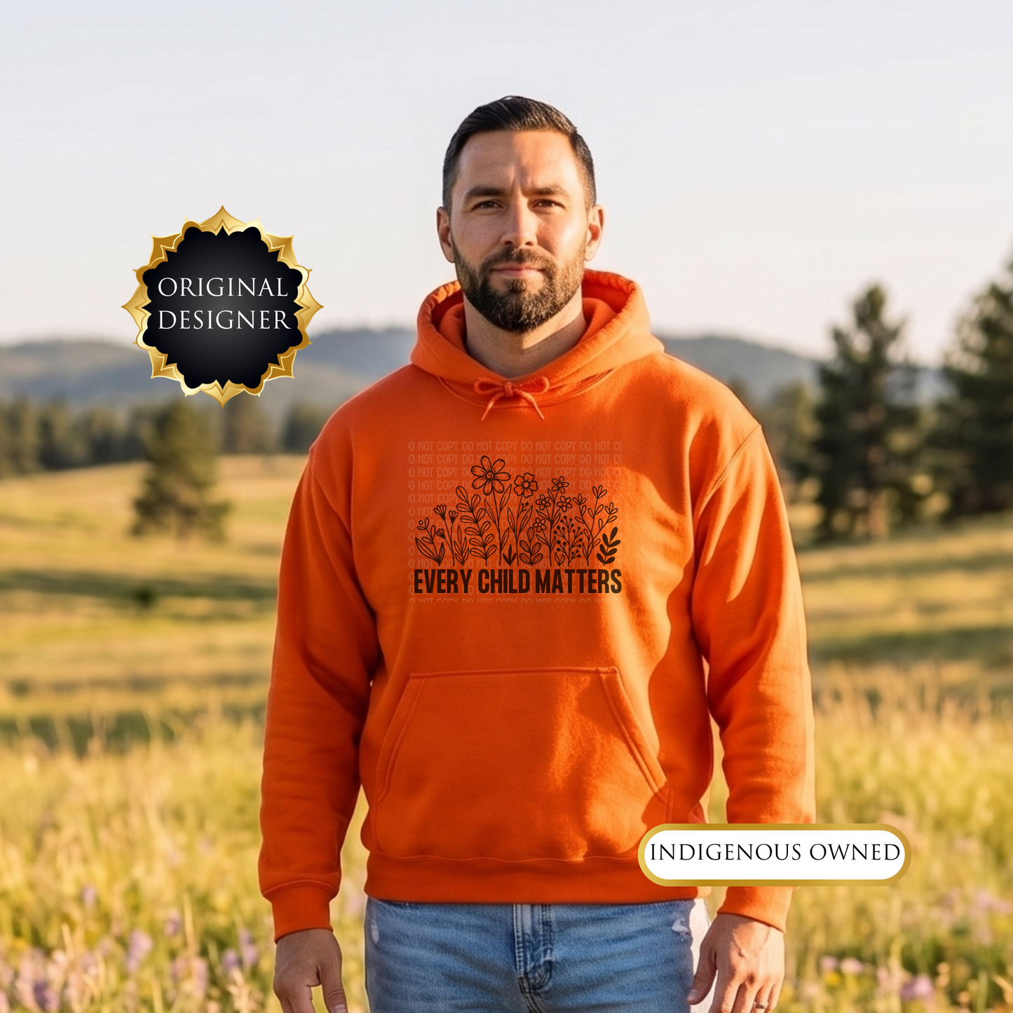 Man wearing an orange hoodie with 'Every Child Matters' text in a field. every child matters hoodie, adult hoodie, orange shirt day hoodie, wildflowers hoodie, indigenous awareness hoodie, truth and reconciliation hoodie, every child matters pullover, orange pullover, meaningful hoodie, indigenous designed apparel, adult graphic hoodie, orange shirt society licensed, awareness hoodie, remembrance hoodie, indigenous owned business