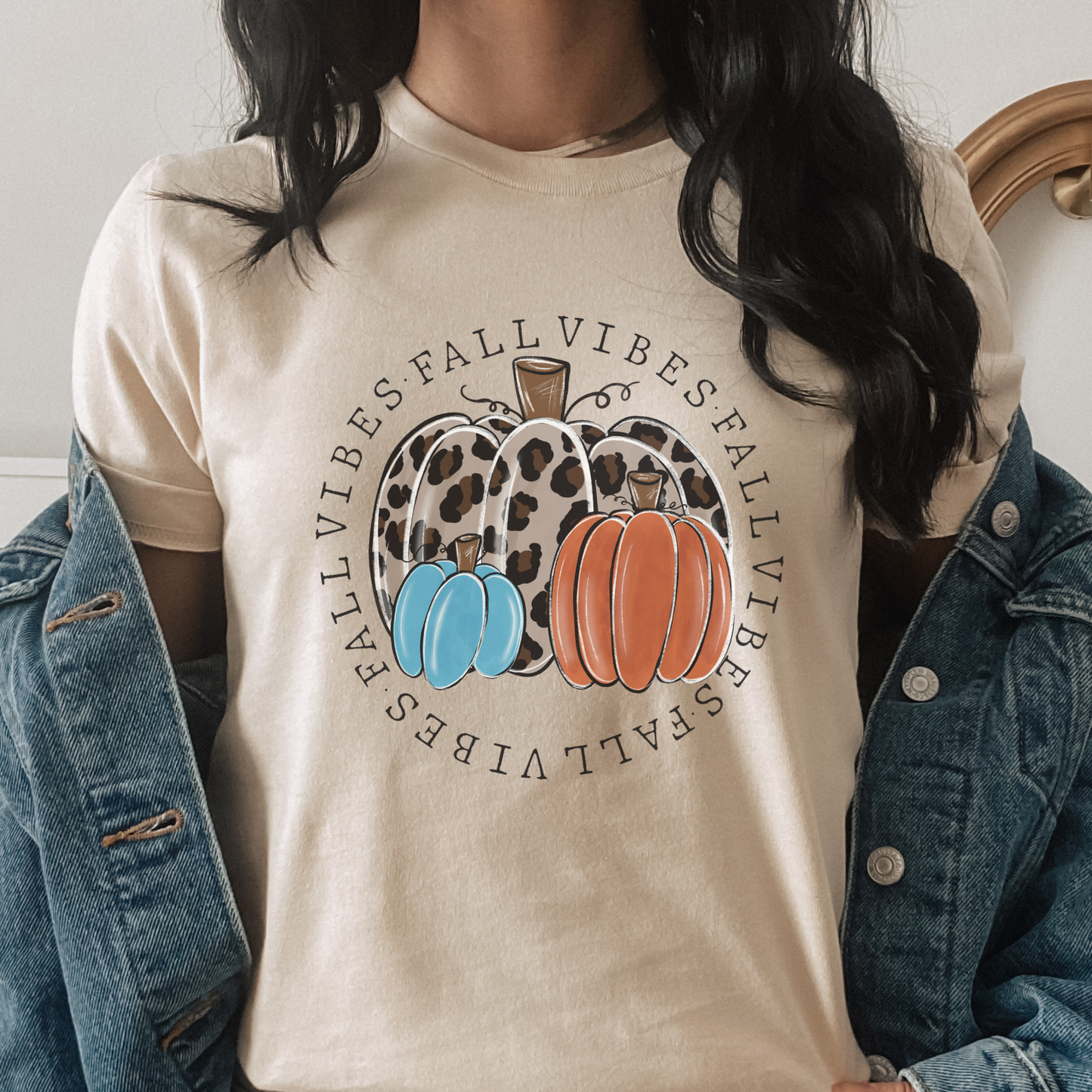 t-shirt featuring decorative pumpkins in autumn colors surrounded by circular "Fall Vibes" text, creating a cozy seasonal design perfect for fall lovers. fall vibes shirt, autumn pumpkin shirt, fall aesthetic t-shirt, pumpkin patch outfit, cozy autumn apparel, pumpkin lover tee, fall festival shirt, thanksgiving clothing, sweater weather shirt, autumn graphic tee, rustic fall fashion, pumpkin spice season apparel, cute fall shirt, fall lover gift, cozy season clothing
