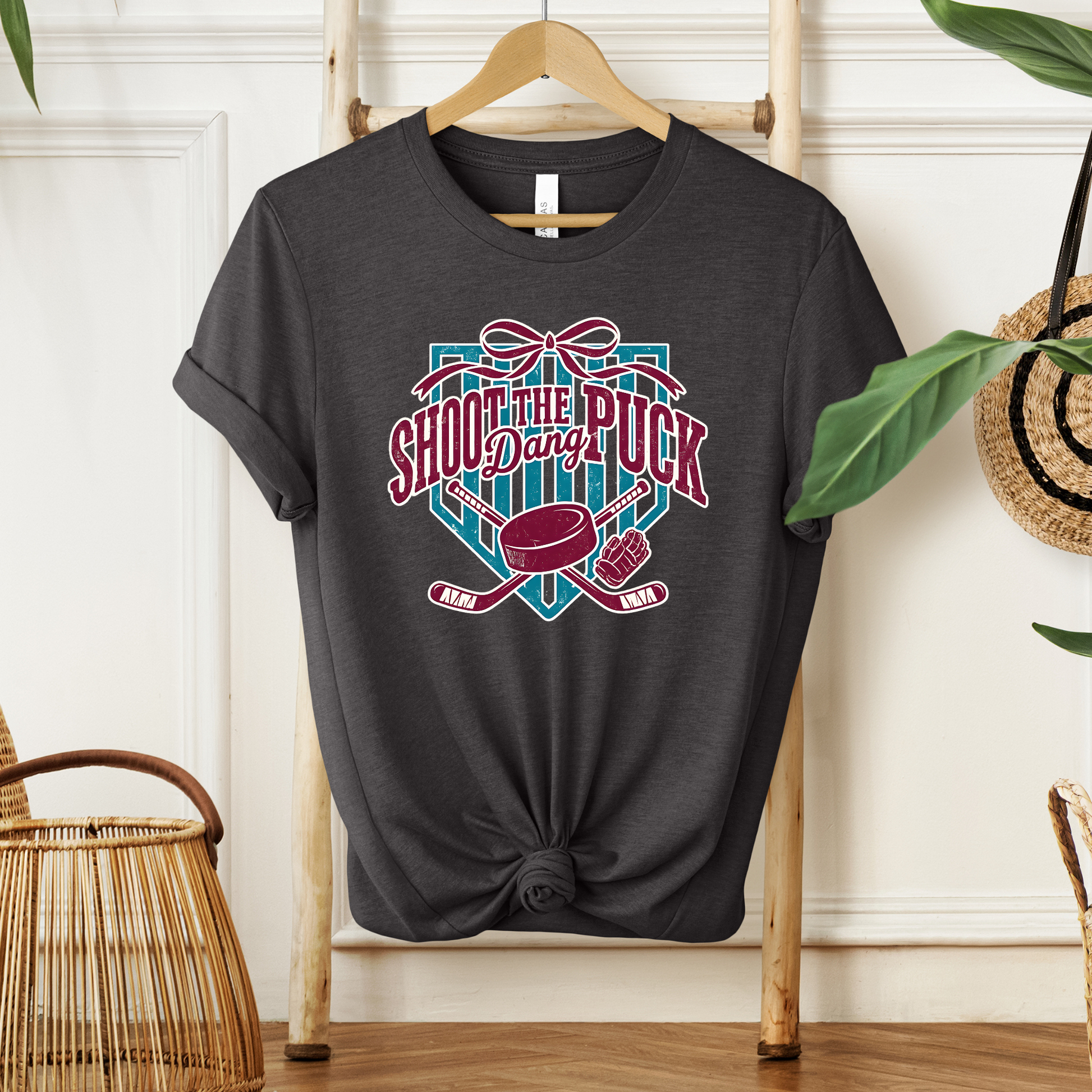 shoot the puck shirt, hockey graphic tee, coquette hockey shirt, hockey bow shirt, trendy hockey shirt, hockey mom shirt, hockey fan shirt, cute hockey shirt, aesthetic hockey tee, hockey sticks shirt, puck shirt, game day hockey outfit, sporty chic shirt, womens hockey shirt, unisex hockey tee