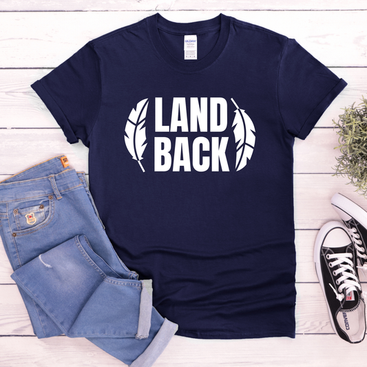 Land Back shirt featuring bold white lettering framed by two feathers, representing Indigenous sovereignty and Indigenous rights.land back shirt, indigenous shirt, indigenous rights shirt, indigenous sovereignty shirt, land back movement, decolonization shirt, indigenous advocacy apparel, indigenous activist shirt, truth and reconciliation shirt, orange shirt day apparel, national indigenous peoples day shirt, indigenous pride shirt, ally shirt, feather shirt, indigenous graphic tee, native rights shirt