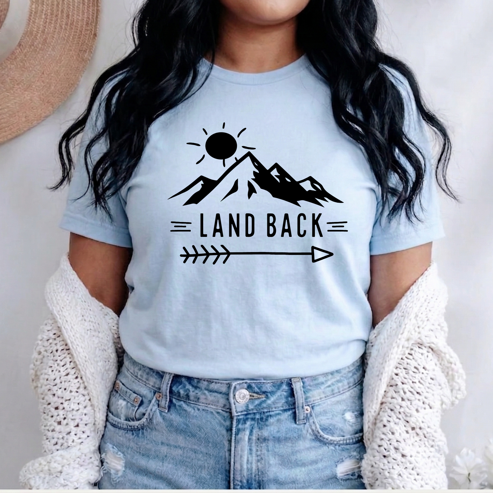 Land Back unisex t-shirt featuring original mountain and sun graphic design symbolizing Indigenous land return movement on soft comfortable cotton tee, perfect for activists and allies.