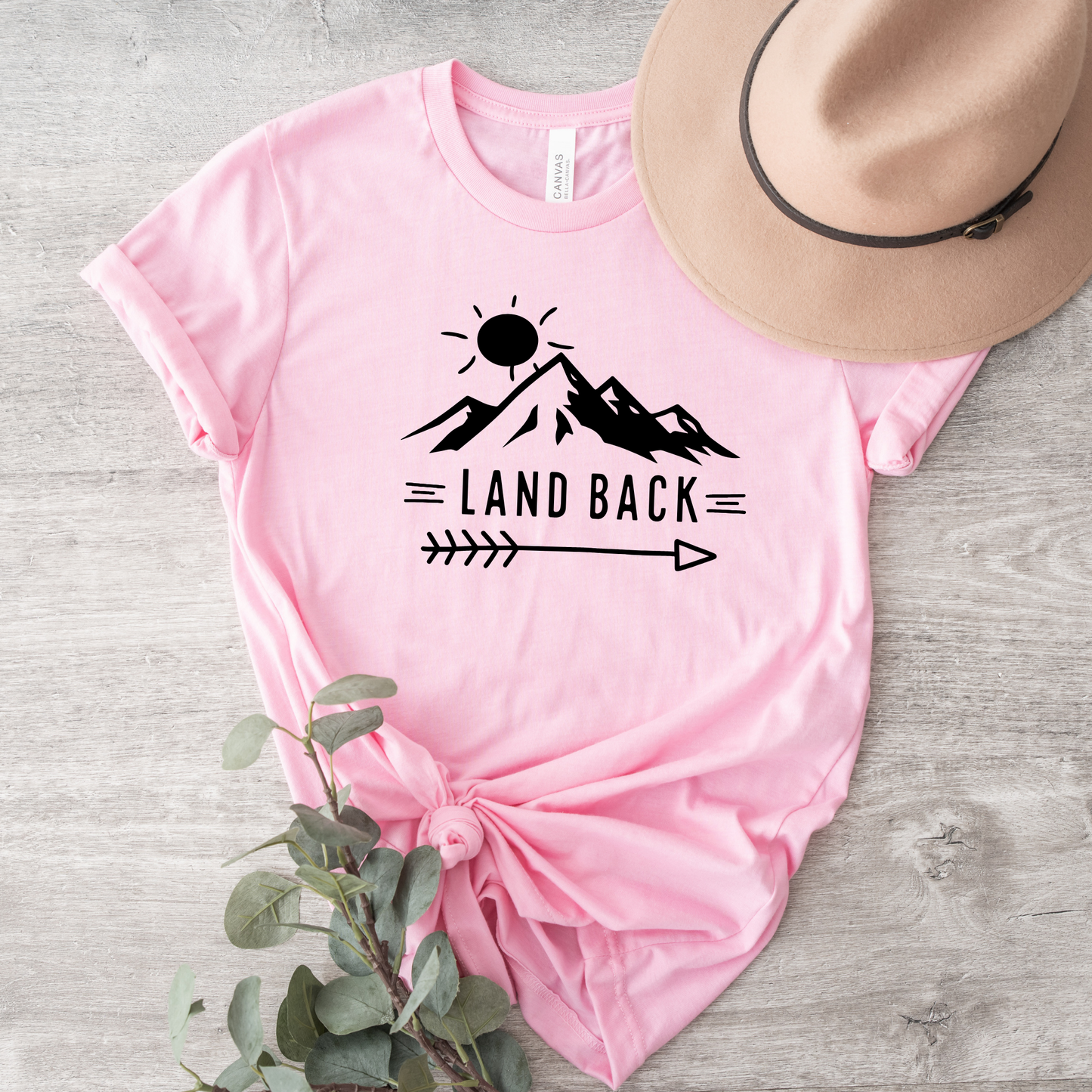 Land Back unisex t-shirt featuring original mountain and sun graphic design symbolizing Indigenous land return movement on soft comfortable cotton tee, perfect for activists and allies.