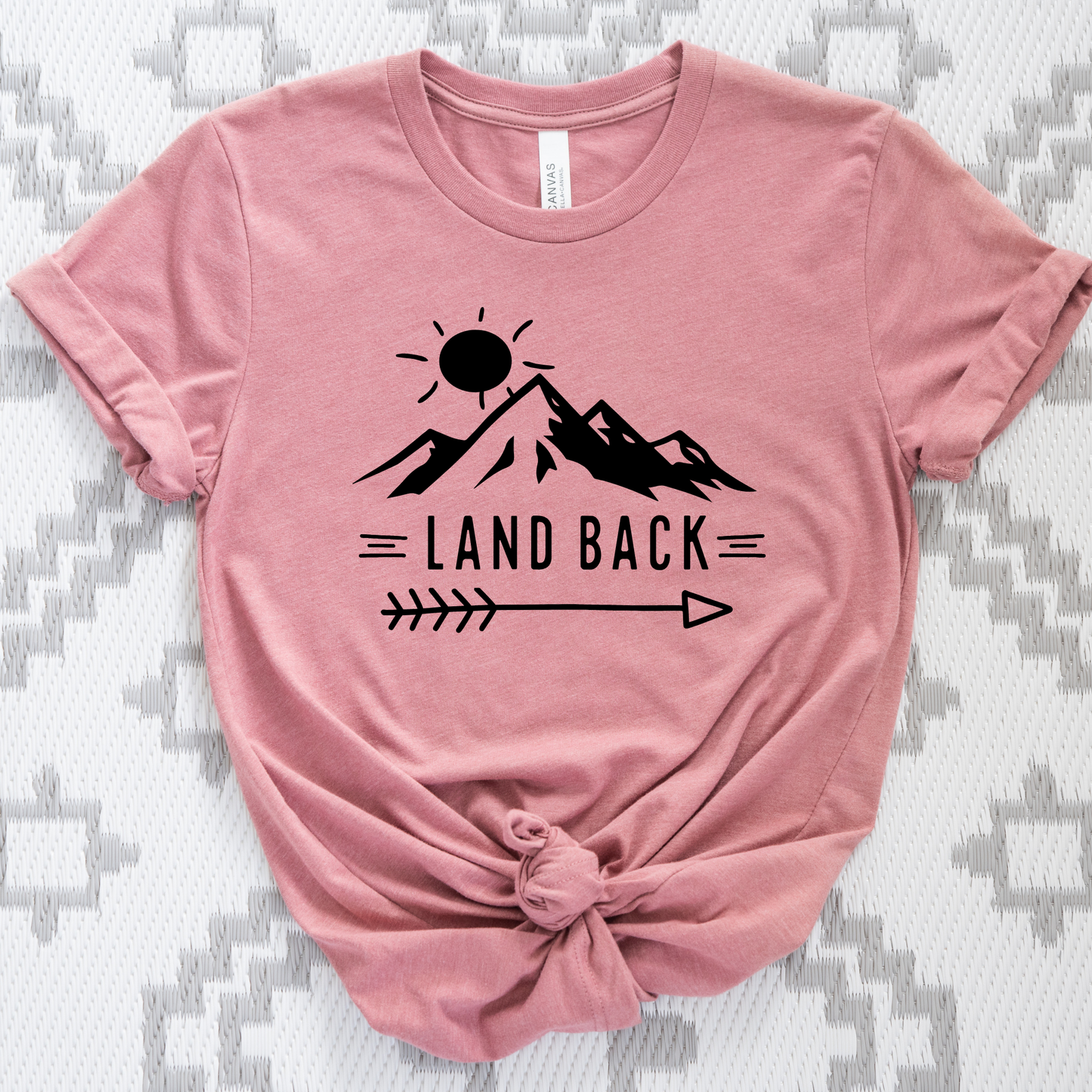 Land Back unisex t-shirt featuring original mountain and sun graphic design symbolizing Indigenous land return movement on soft comfortable cotton tee, perfect for activists and allies.