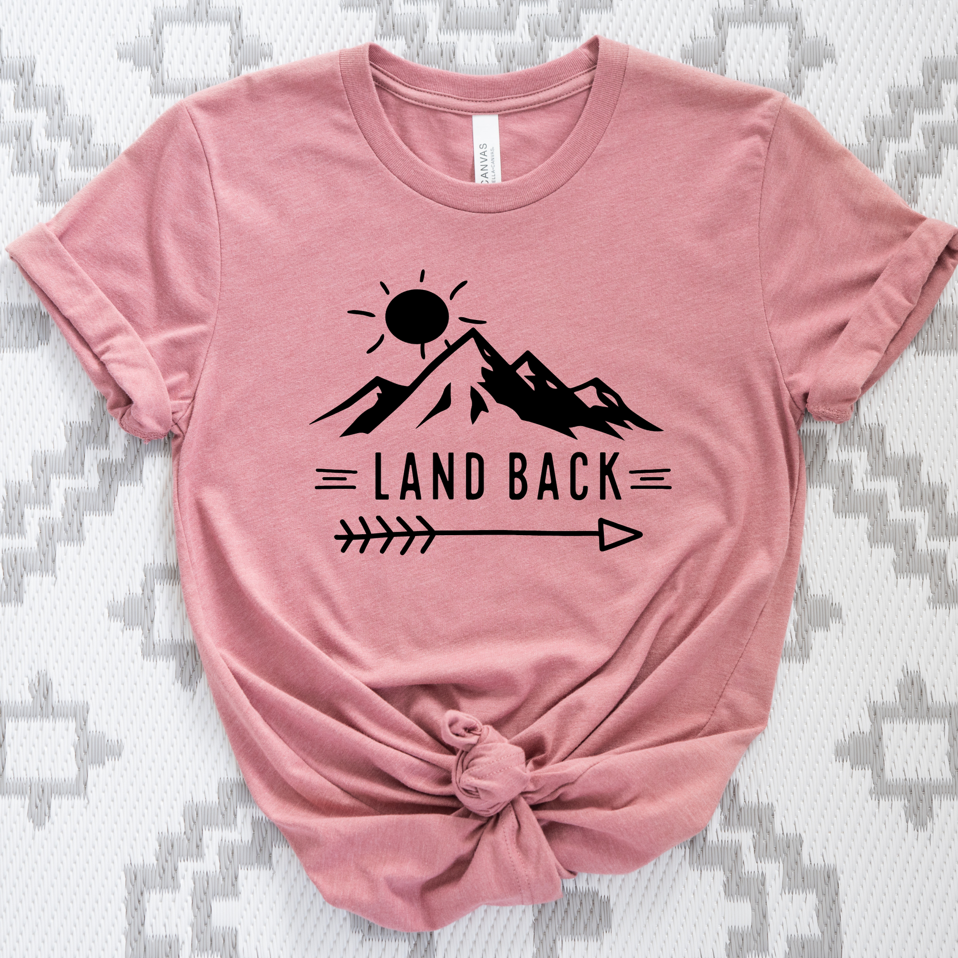 Land Back unisex t-shirt featuring original mountain and sun graphic design symbolizing Indigenous land return movement on soft comfortable cotton tee, perfect for activists and allies.
