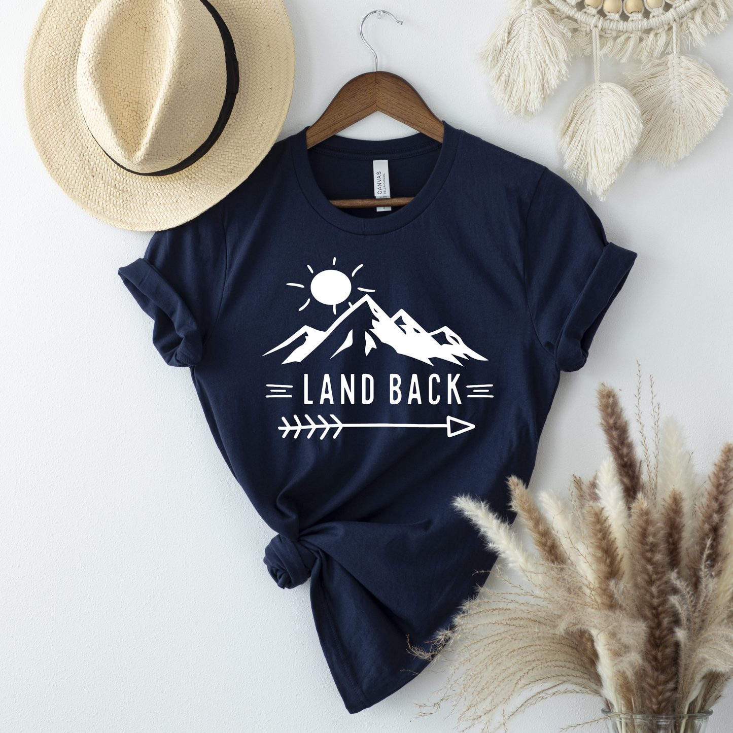 Land Back unisex t-shirt featuring original mountain and sun graphic design symbolizing Indigenous land return movement on soft comfortable cotton tee, perfect for activists and allies.