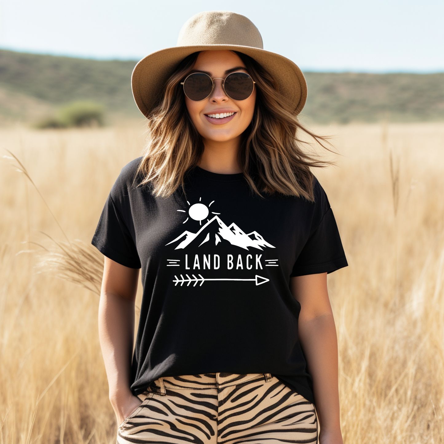 Land Back unisex t-shirt featuring original mountain and sun graphic design symbolizing Indigenous land return movement on soft comfortable cotton tee, perfect for activists and allies.