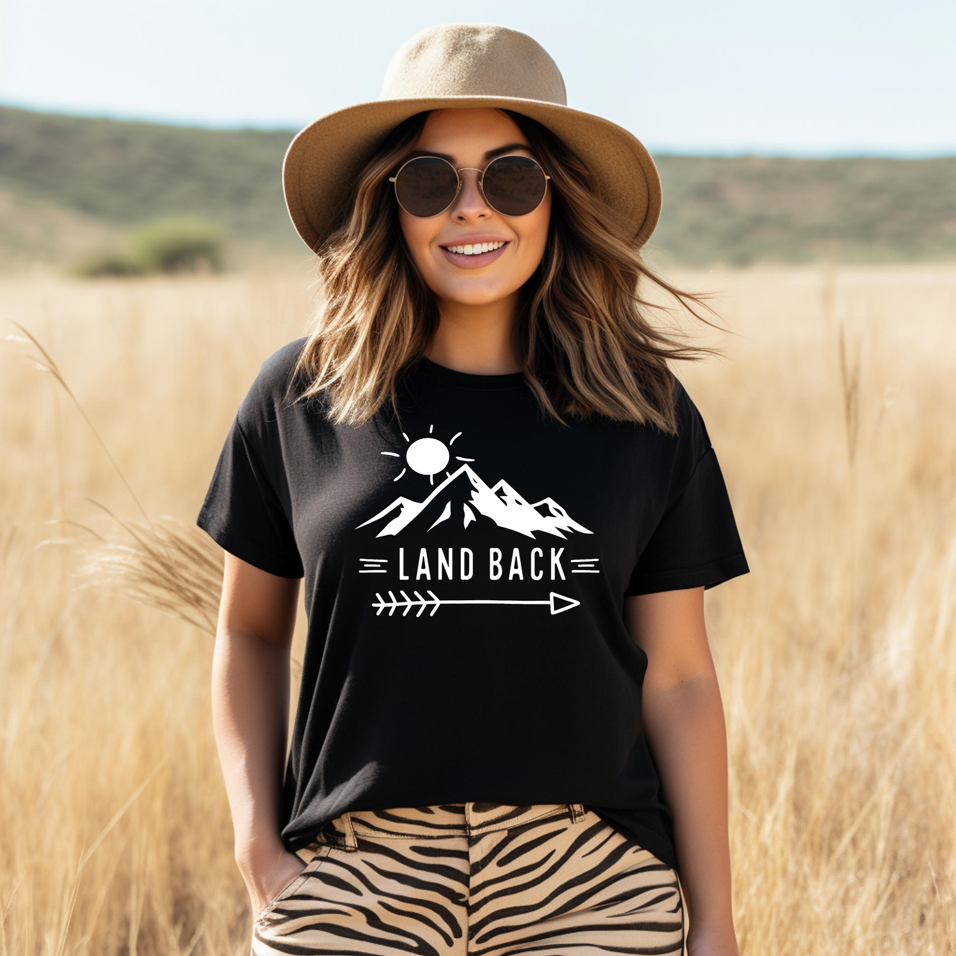 Land Back unisex t-shirt featuring original mountain and sun graphic design symbolizing Indigenous land return movement on soft comfortable cotton tee, perfect for activists and allies.
