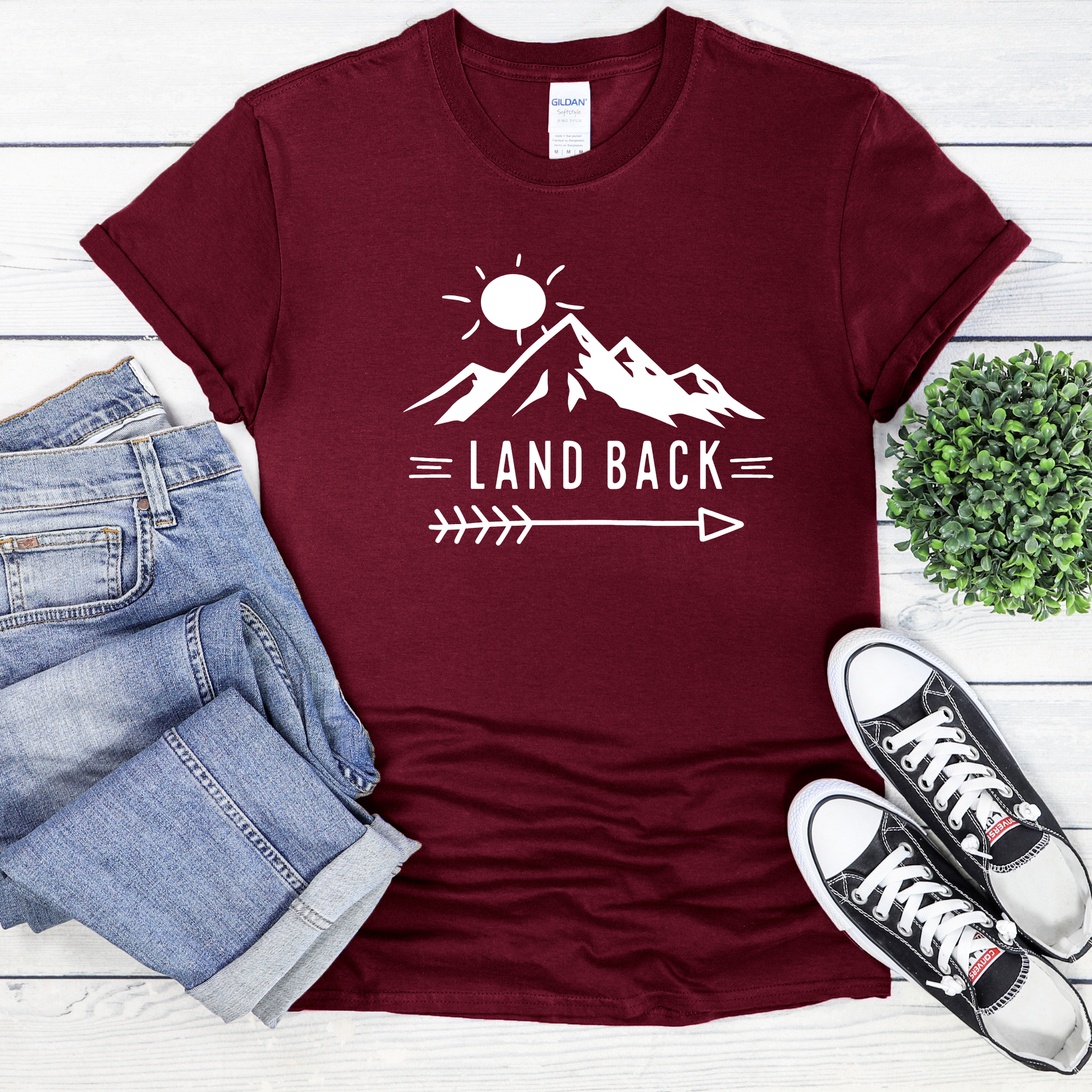 Land Back unisex t-shirt featuring original mountain and sun graphic design symbolizing Indigenous land return movement on soft comfortable cotton tee, perfect for activists and allies.