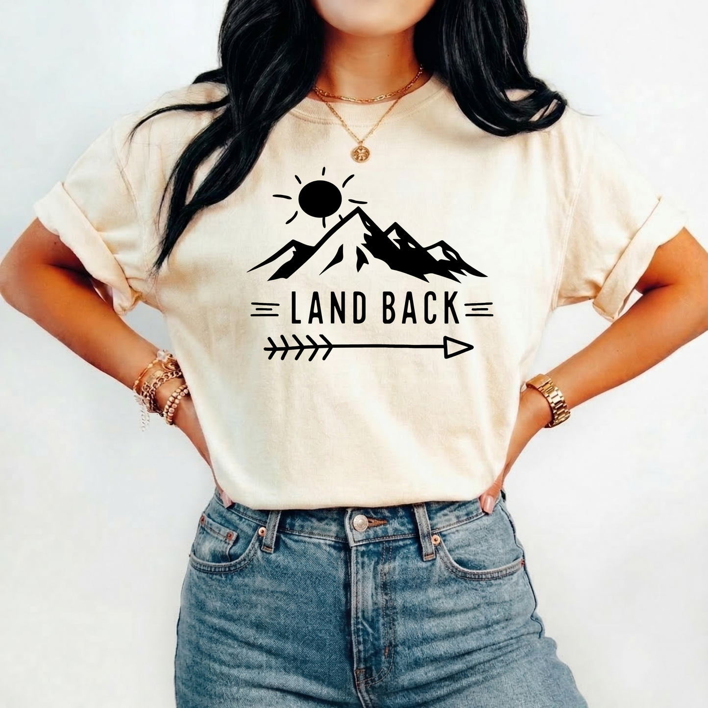 Land Back unisex t-shirt featuring original mountain and sun graphic design symbolizing Indigenous land return movement on soft comfortable cotton tee, perfect for activists and allies.