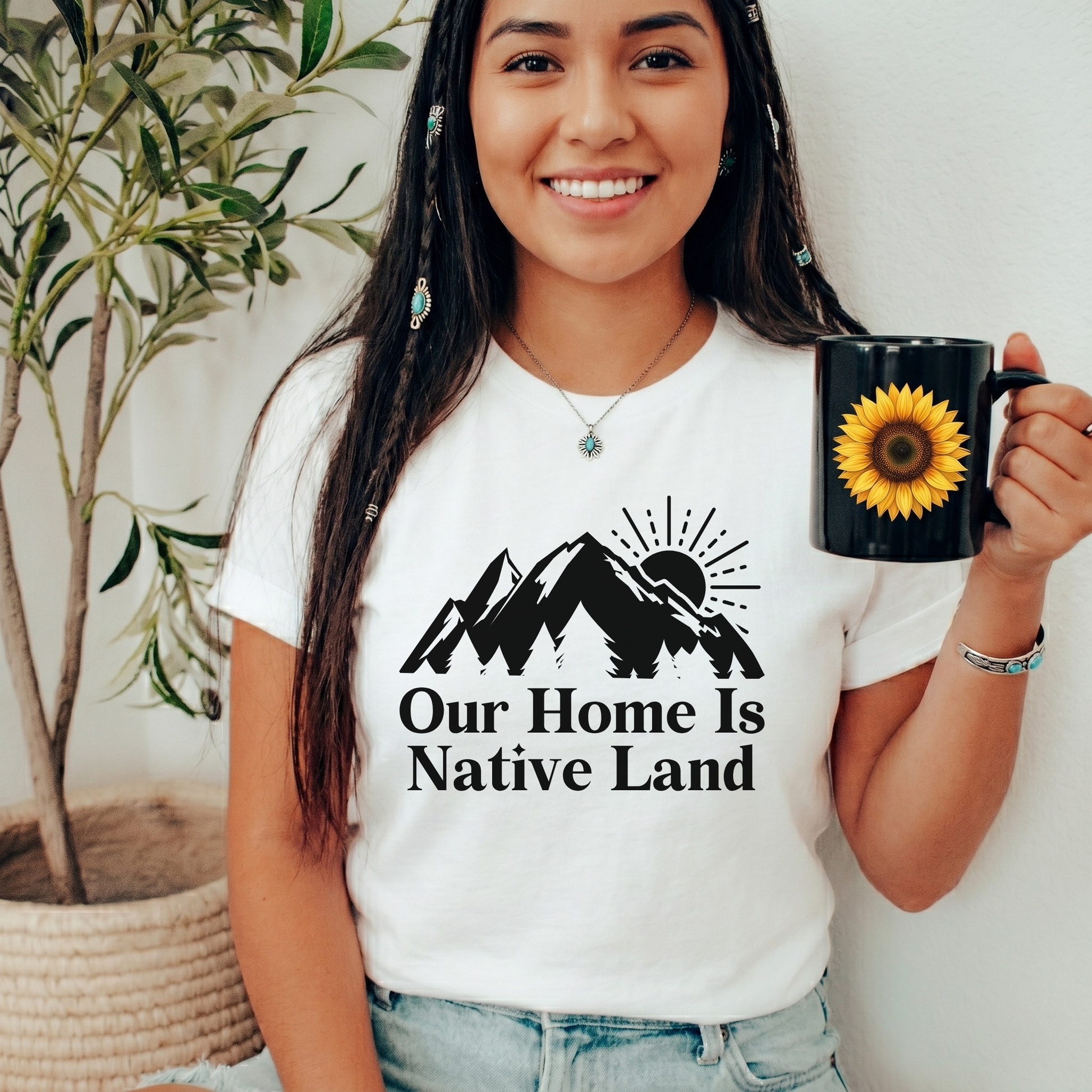 Our Home Is Native Land shirt with white mountain and sunrise graphic on a unisex t-shirt. our home is native land shirt, indigenous pride tee, native pride shirt, indigenous apparel, unisex graphic tee, land acknowledgment shirt, indigenous awareness shirt, statement tee, mountain sunrise shirt, everyday wear shirt, community event shirt, indigenous clothing, native land shirt, meaningful graphic tee, cultural pride shirt