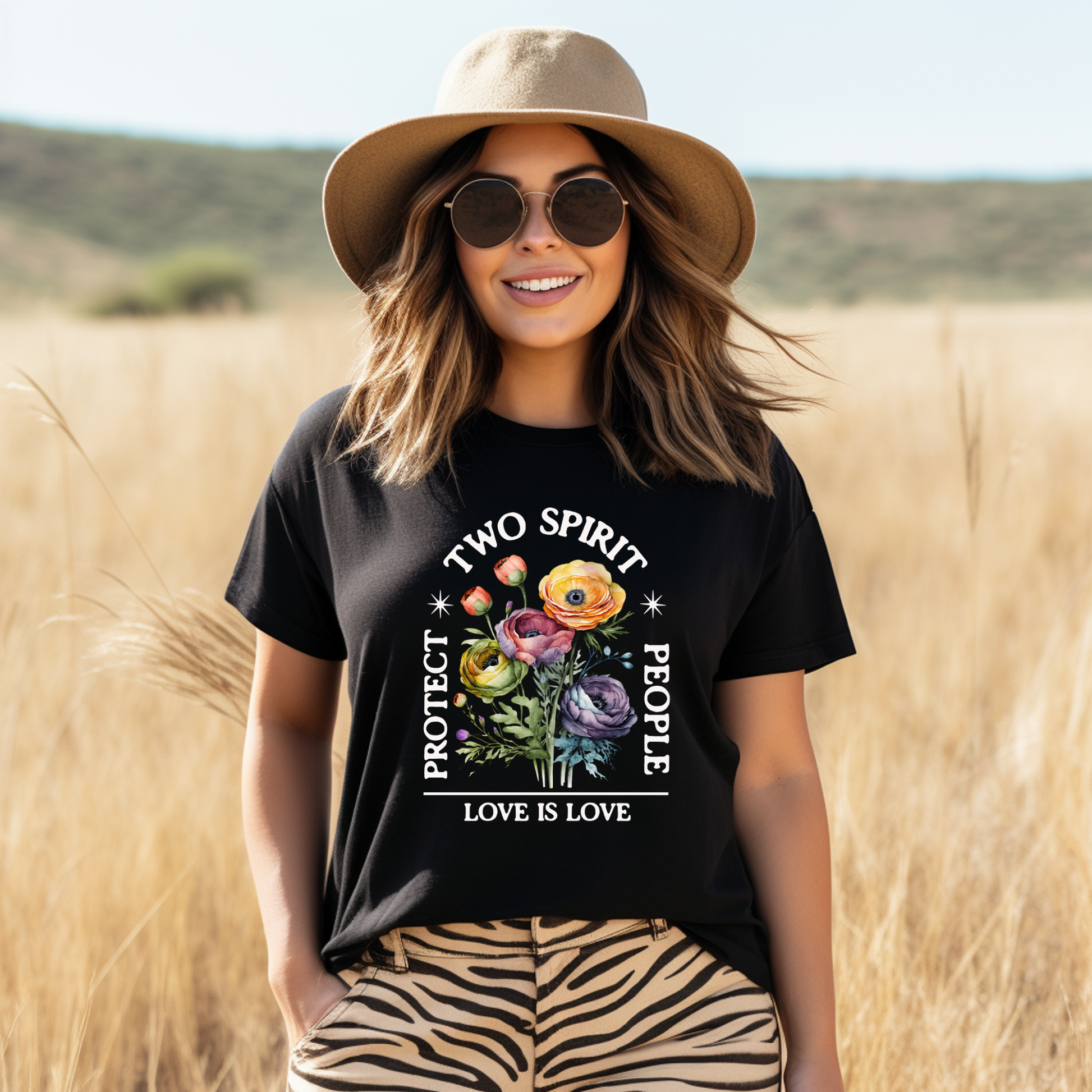 Woman wearing a black t-shirt with 'Two Spirit People Protect Love is Love' design in a field. protect two spirit people shirt, love is love two spirit tee, indigenous lgbtq shirt, two spirit pride t-shirt, indigenous pride apparel, lgbtq indigenous tee, two spirit advocacy shirt, love is love unisex tee, 2s pride shirt, indigenous lgbtq clothing, two spirit protection tee, queer indigenous apparel