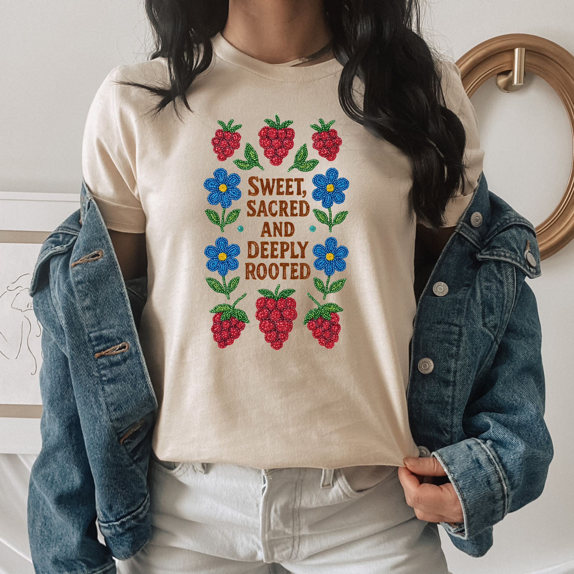 Unisex Sweet Sacred Deeply Rooted shirt featuring original Indigenous beaded floral and berry design with intricate beadwork patterns, vibrant pink berries, and delicate flowers on soft heather fabric