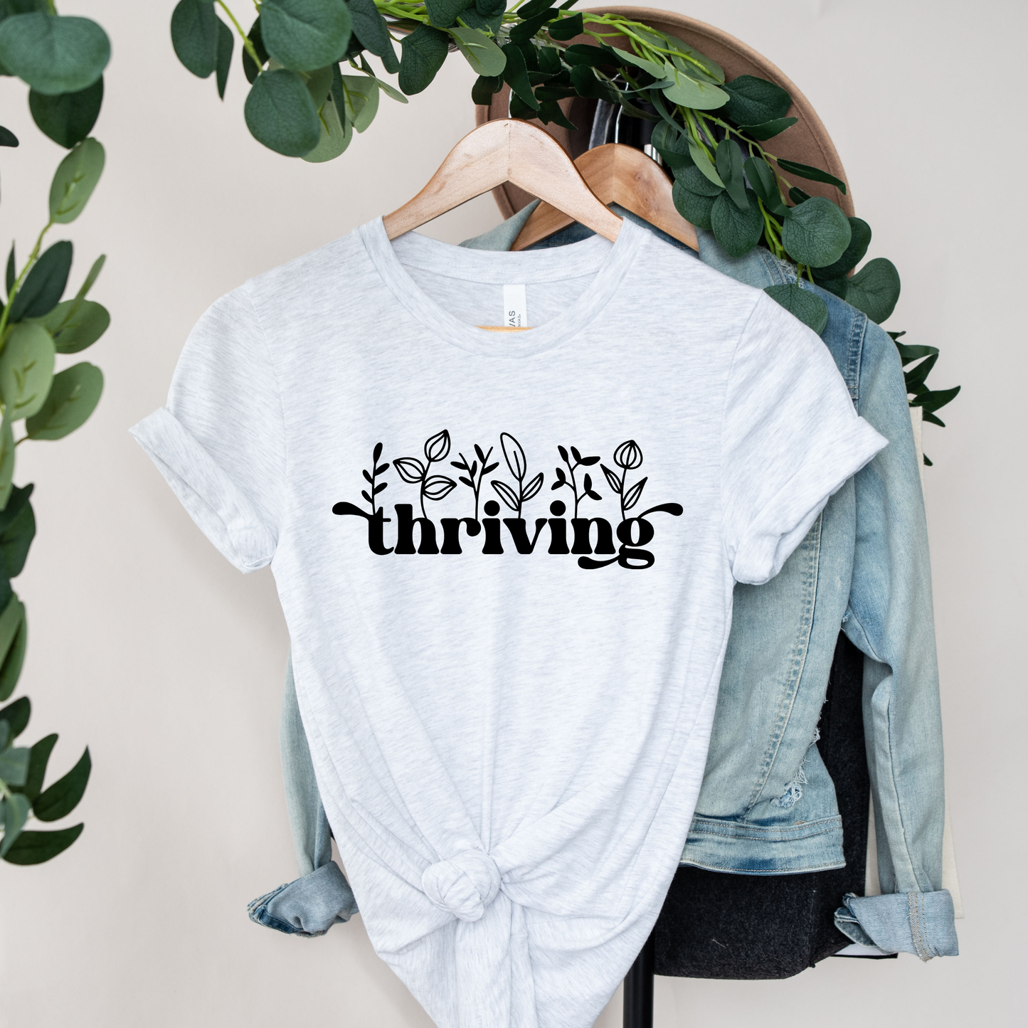 thriving shirt, floral graphic tee, positive affirmation shirt, inspirational shirt, motivational tee, unisex graphic tee, botanical shirt, empowering apparel, everyday wear shirt, confidence shirt, uplifting gift, statement shirt, positive mindset tee, floral typography shirt, casual inspirational tee