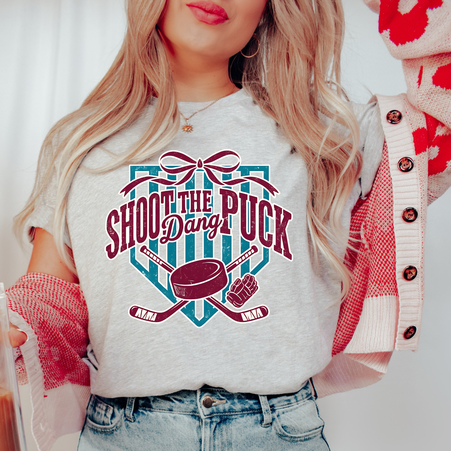 shoot the puck shirt, hockey graphic tee, coquette hockey shirt, hockey bow shirt, trendy hockey shirt, hockey mom shirt, hockey fan shirt, cute hockey shirt, aesthetic hockey tee, hockey sticks shirt, puck shirt, game day hockey outfit, sporty chic shirt, womens hockey shirt, unisex hockey tee