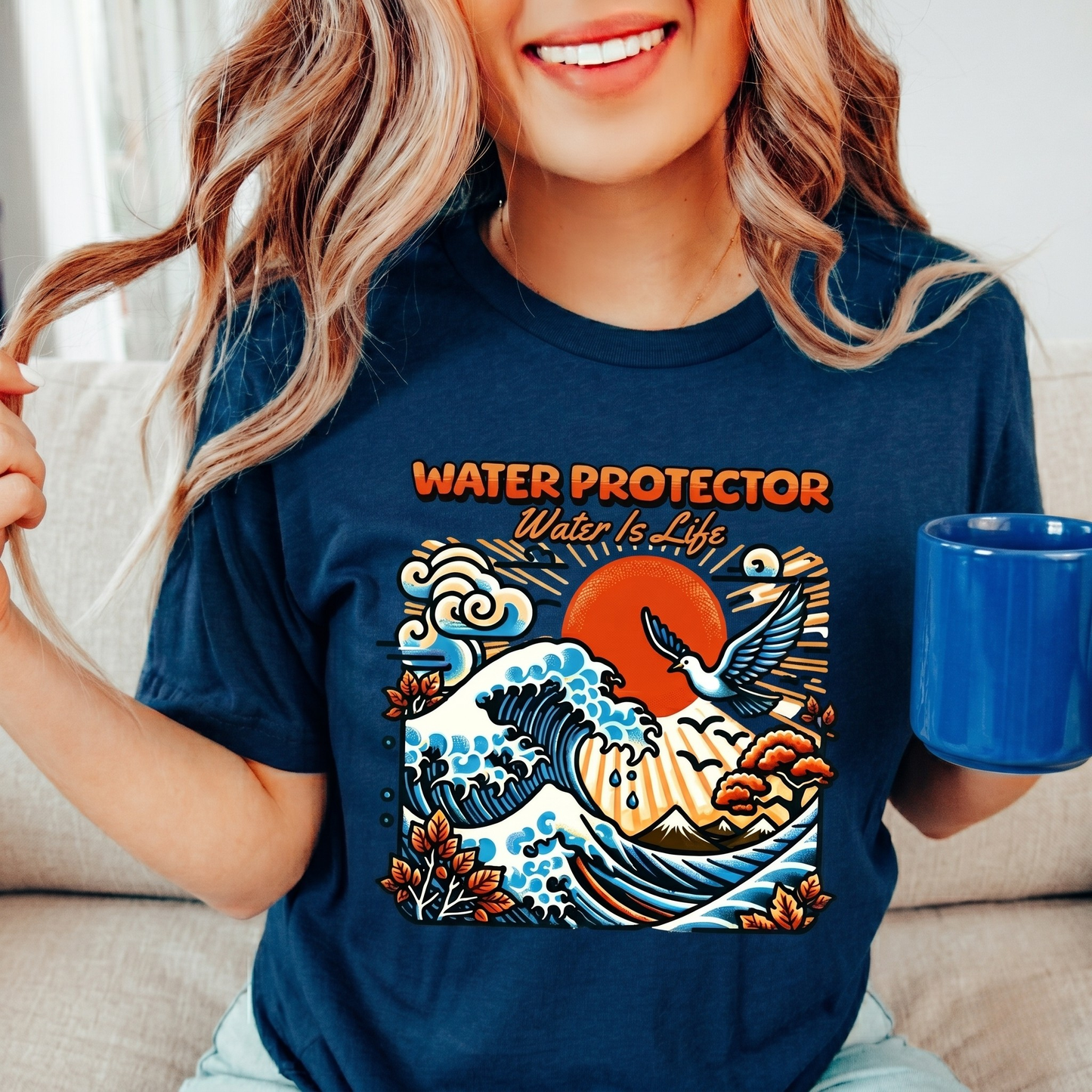 t-shirt featuring a colorful "Water Protector – Water Is Life" graphic with ocean waves, birds, mountains, autumn leaves, and a vibrant sunset, symbolizing environmental stewardship and respect for water. water protector shirt, water is life t-shirt, indigenous environmental apparel, protect our water shirt, environmental awareness tee, sustainability shirt, indigenous advocacy clothing, water stewardship apparel, activist graphic tee, nature lover t-shirt, earth day apparel, eco conscious clothing, environ