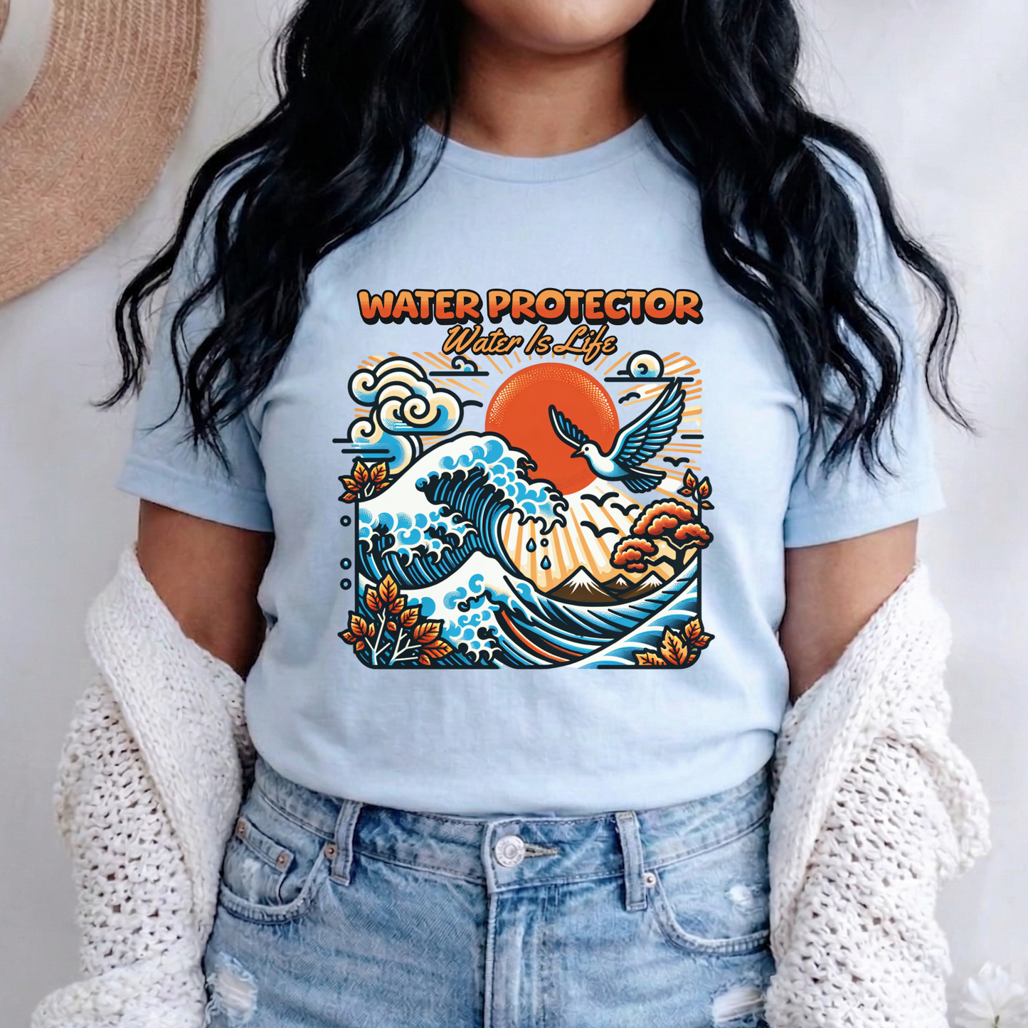 t-shirt featuring a colorful "Water Protector – Water Is Life" graphic with ocean waves, birds, mountains, autumn leaves, and a vibrant sunset, symbolizing environmental stewardship and respect for water. water protector shirt, water is life t-shirt, indigenous environmental apparel, protect our water shirt, environmental awareness tee, sustainability shirt, indigenous advocacy clothing, water stewardship apparel, activist graphic tee, nature lover t-shirt, earth day apparel, eco conscious clothing, environ