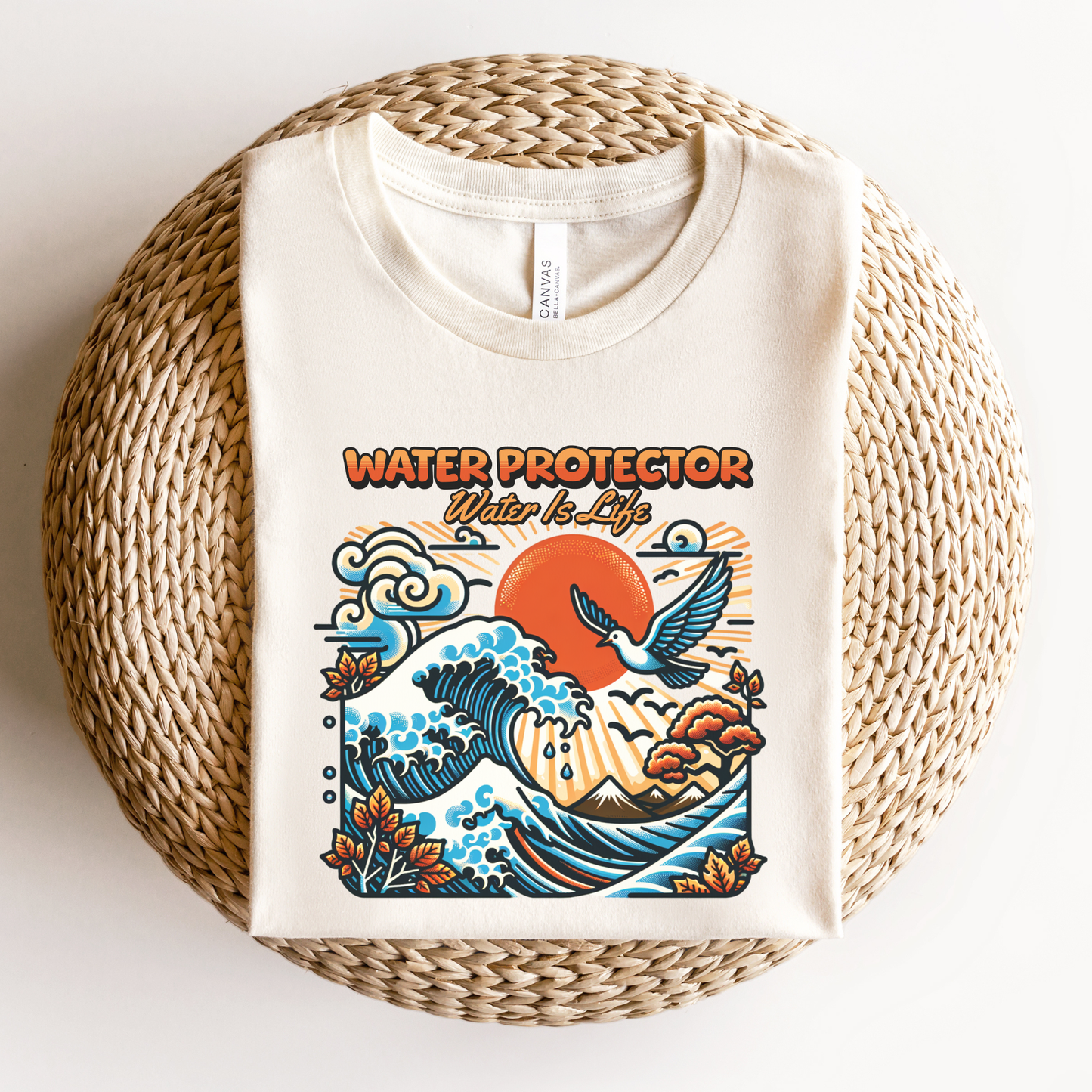 t-shirt featuring a colorful "Water Protector – Water Is Life" graphic with ocean waves, birds, mountains, autumn leaves, and a vibrant sunset, symbolizing environmental stewardship and respect for water. water protector shirt, water is life t-shirt, indigenous environmental apparel, protect our water shirt, environmental awareness tee, sustainability shirt, indigenous advocacy clothing, water stewardship apparel, activist graphic tee, nature lover t-shirt, earth day apparel, eco conscious clothing, environ